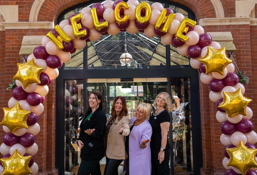 West Midlands Care Home - Four Women Under a Balloon Arch Outside Blossomfield Care Home