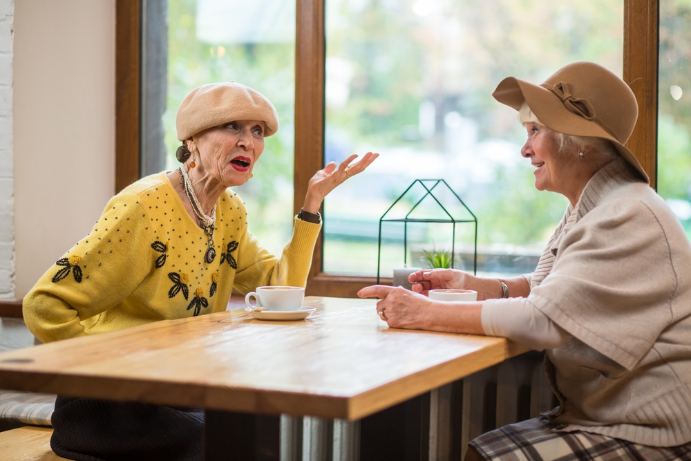 Two older women confiding in each other